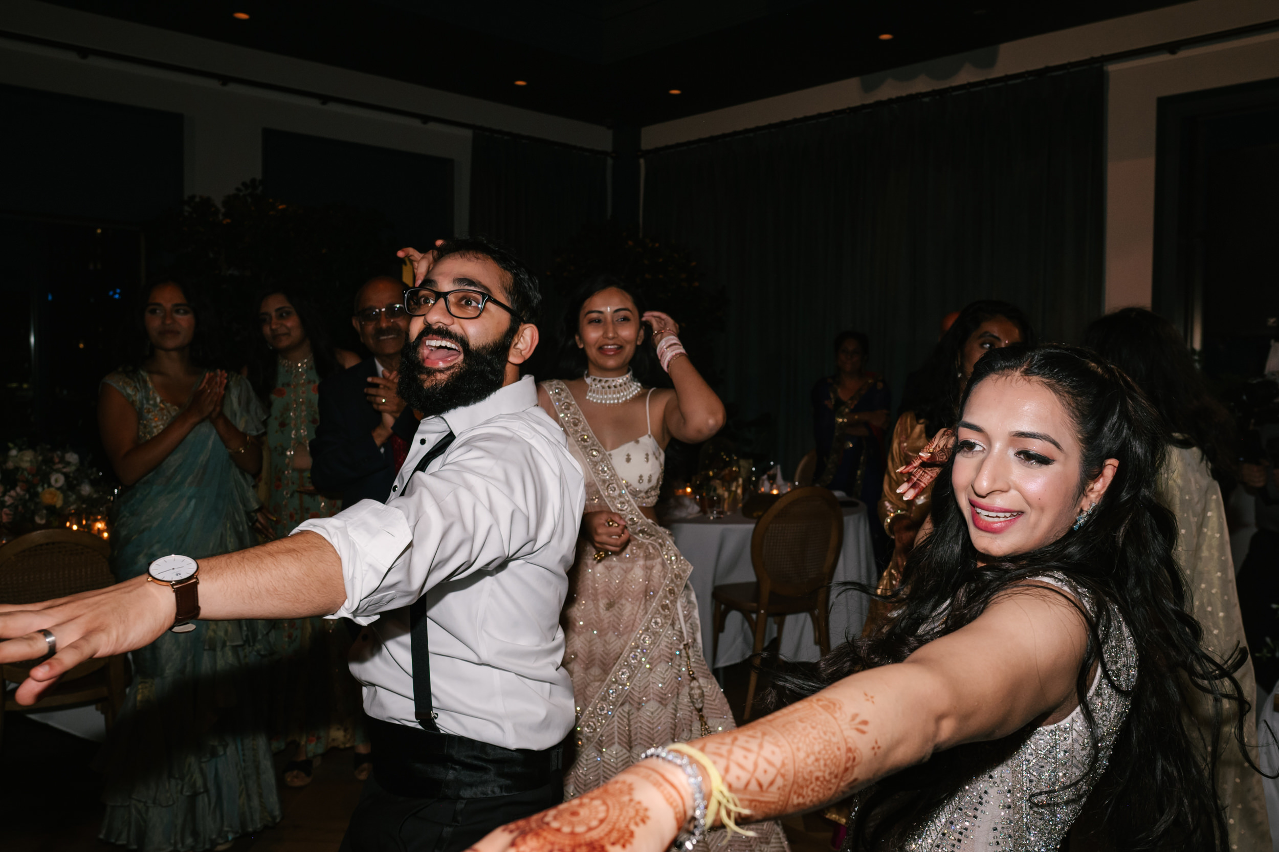 Detroit Indian Wedding Reception dancing captured by a Michigan Indian Wedding Photographer, Strokes Photography. 